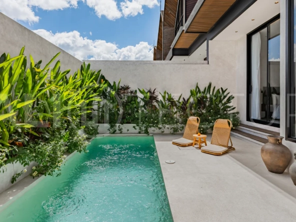 Modern 2-bedroom villa for sale near Pererenan Beach, Canggu, featuring stylish interiors, spacious living areas, tropical greenery, and a private swimming pool.