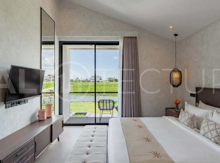 Modern 2-bedroom villa for sale near Pererenan Beach, Canggu, featuring stylish interiors, spacious living areas, tropical greenery, and a private swimming pool.