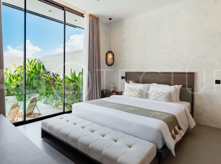 Modern 2-bedroom villa for sale near Pererenan Beach, Canggu, featuring stylish interiors, spacious living areas, tropical greenery, and a private swimming pool.