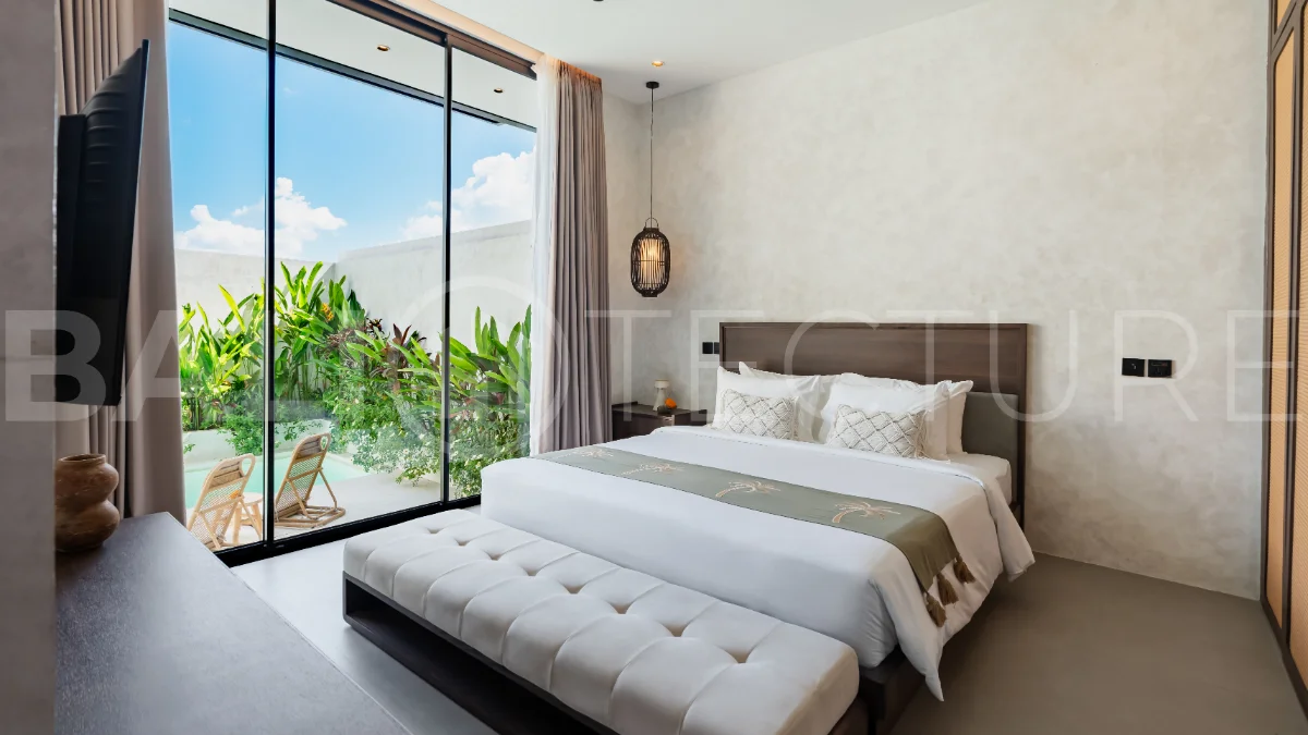 Modern 2-bedroom villa for sale near Pererenan Beach, Canggu, featuring stylish interiors, spacious living areas, tropical greenery, and a private swimming pool.