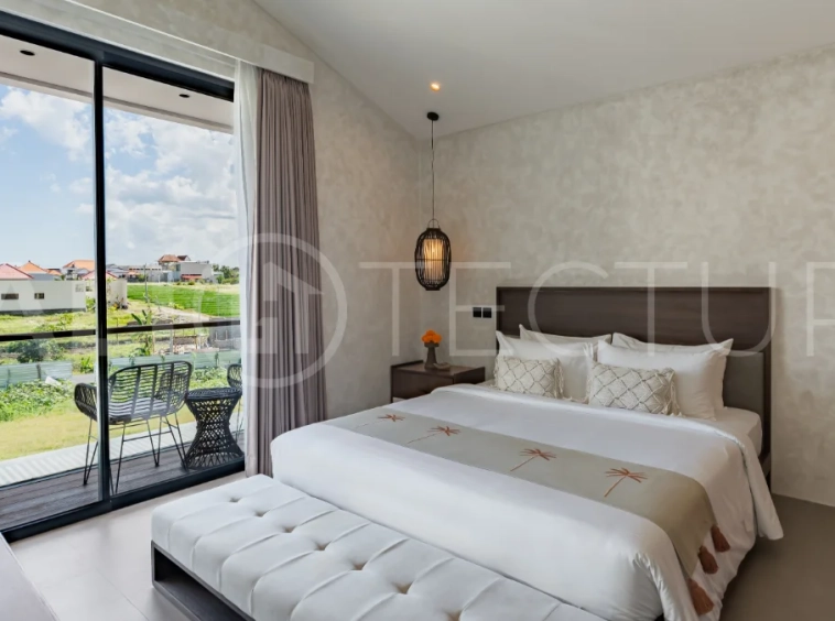Modern 2-bedroom villa for sale near Pererenan Beach, Canggu, featuring stylish interiors, spacious living areas, tropical greenery, and a private swimming pool.