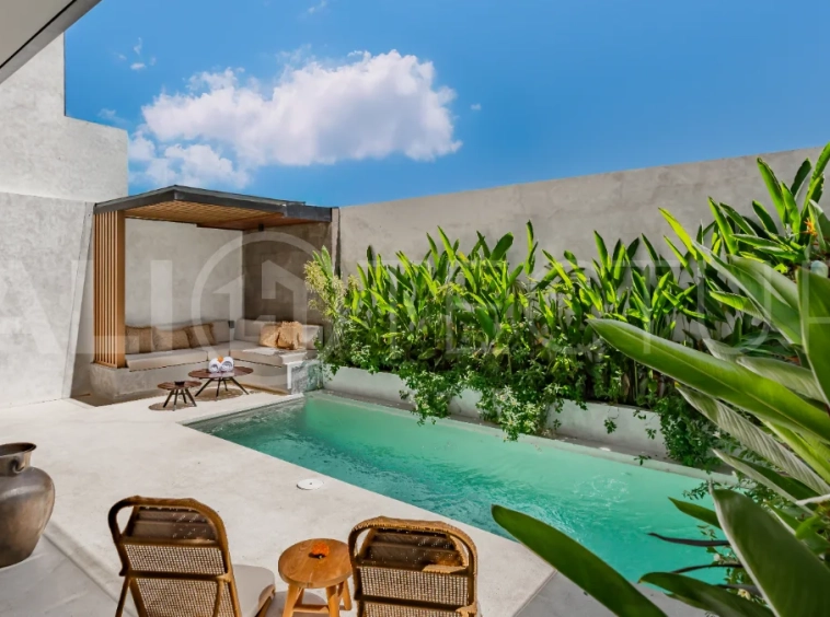 Modern 2-bedroom villa for sale near Pererenan Beach, Canggu, featuring stylish interiors, spacious living areas, tropical greenery, and a private swimming pool.