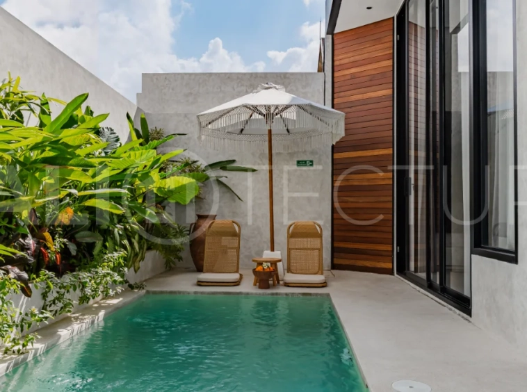 Modern 2-bedroom villa for sale near Pererenan Beach, Canggu, featuring stylish interiors, spacious living areas, tropical greenery, and a private swimming pool.