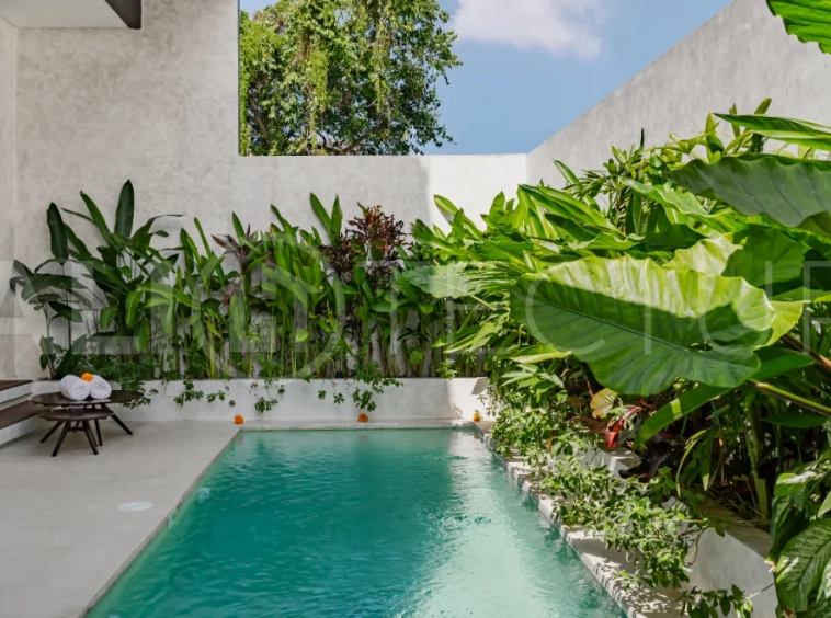 Modern 2-bedroom villa for sale near Pererenan Beach, Canggu, featuring stylish interiors, spacious living areas, tropical greenery, and a private swimming pool.