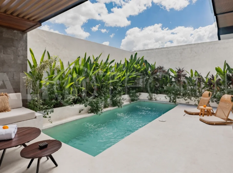 Modern 2-bedroom villa for sale near Pererenan Beach, Canggu, featuring stylish interiors, spacious living areas, tropical greenery, and a private swimming pool.