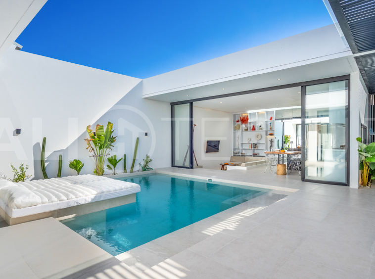 Brand new 2-bedroom villa with private pool for sale near Mertasari Beach, Sanur, featuring a fully furnished interior, 3 bathrooms, enclosed living area, and contemporary tropical design.