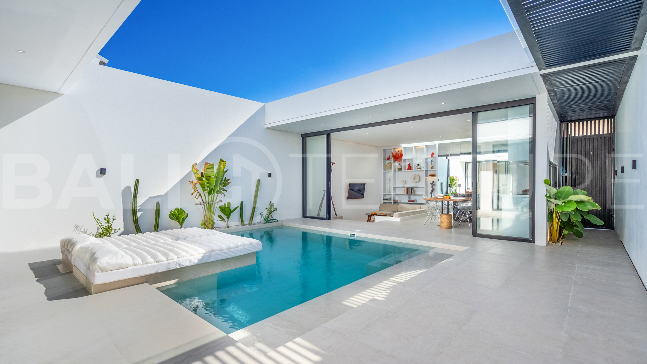 Brand new 2-bedroom villa with private pool for sale near Mertasari Beach, Sanur, featuring a fully furnished interior, 3 bathrooms, enclosed living area, and contemporary tropical design.