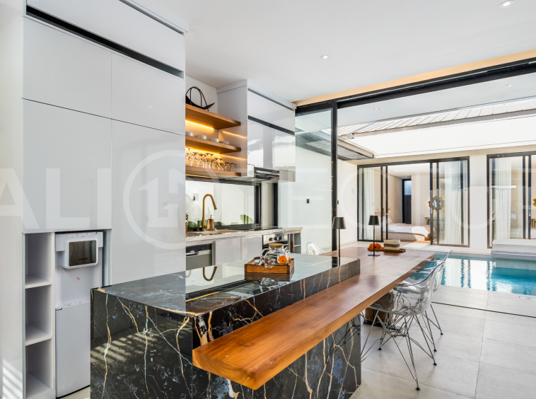 Brand new 2-bedroom villa with private pool for sale near Mertasari Beach, Sanur, featuring a fully furnished interior, 3 bathrooms, enclosed living area, and contemporary tropical design.