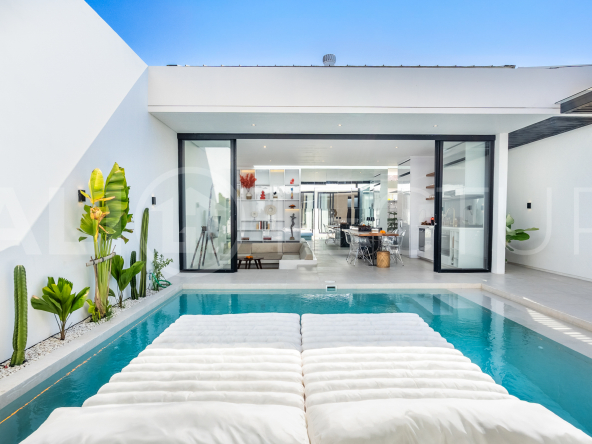 Brand new 2-bedroom villa with private pool for sale near Mertasari Beach, Sanur, featuring a fully furnished interior, 3 bathrooms, enclosed living area, and contemporary tropical design.