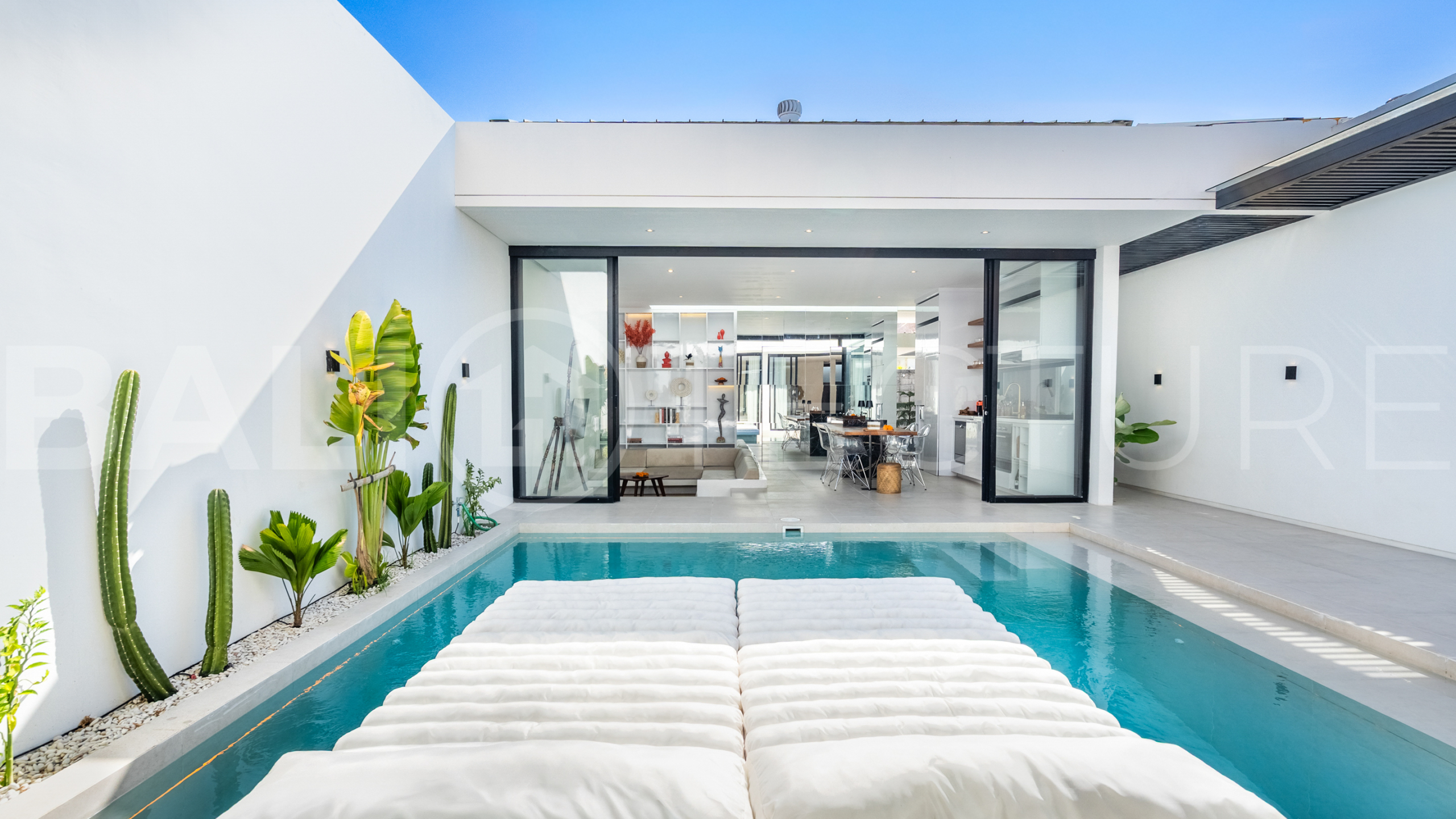 Brand new 2-bedroom villa with private pool for sale near Mertasari Beach, Sanur, featuring a fully furnished interior, 3 bathrooms, enclosed living area, and contemporary tropical design.