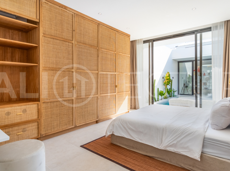 Brand new 2-bedroom villa with private pool for sale near Mertasari Beach, Sanur, featuring a fully furnished interior, 3 bathrooms, enclosed living area, and contemporary tropical design.