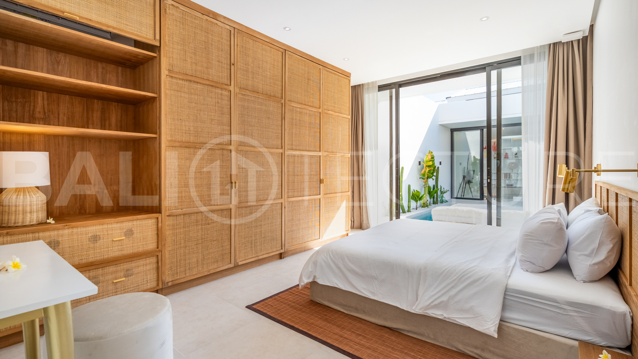 Brand new 2-bedroom villa with private pool for sale near Mertasari Beach, Sanur, featuring a fully furnished interior, 3 bathrooms, enclosed living area, and contemporary tropical design.