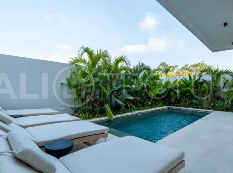 Luxury 3 Bedroom Ocean View Villa for Sale in Ungasan featuring contemporary interiors, a spacious open plan living and dining area, fully equipped designer kitchen with island, three ensuite bedrooms with walk in wardrobes and private balconies, a private swimming pool, panoramic sea views, a 126 sqm rooftop with outdoor kitchenette and entertaining area, plus a private sauna and ice bath. Set on 225 sqm of land with a 477 sqm building area, offered with a 28 year leasehold and guaranteed 30 year extension.