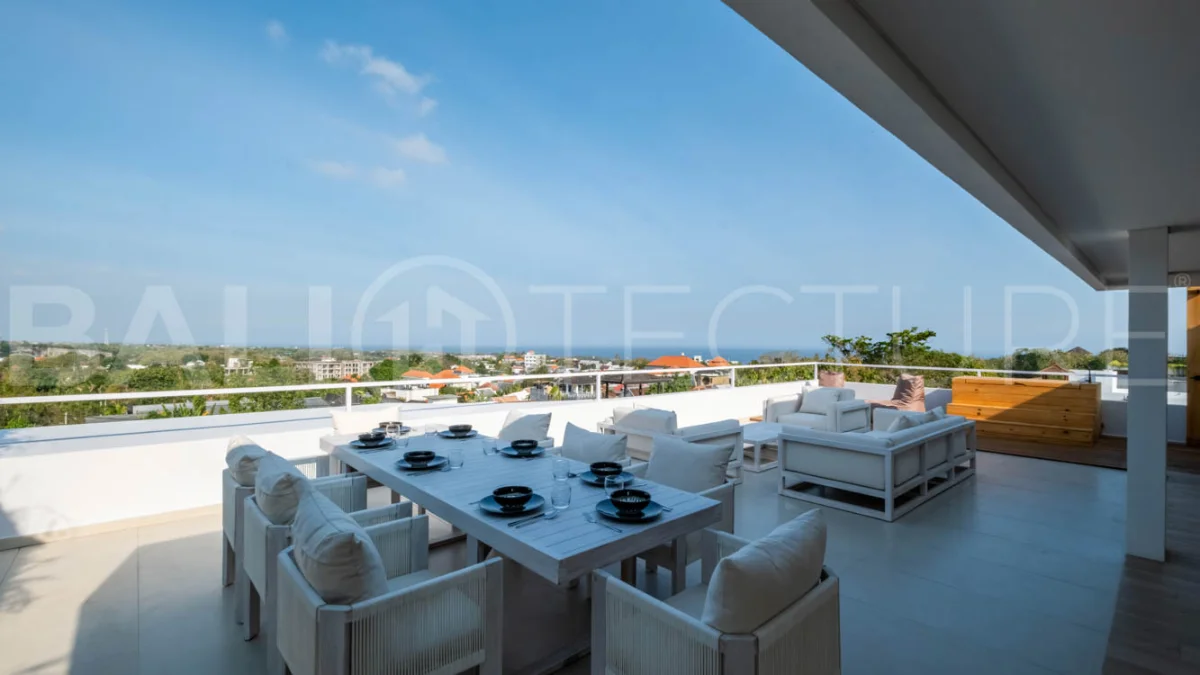 Luxury 3 Bedroom Ocean View Villa for Sale in Ungasan featuring contemporary interiors, a spacious open plan living and dining area, fully equipped designer kitchen with island, three ensuite bedrooms with walk in wardrobes and private balconies, a private swimming pool, panoramic sea views, a 126 sqm rooftop with outdoor kitchenette and entertaining area, plus a private sauna and ice bath. Set on 225 sqm of land with a 477 sqm building area, offered with a 28 year leasehold and guaranteed 30 year extension.