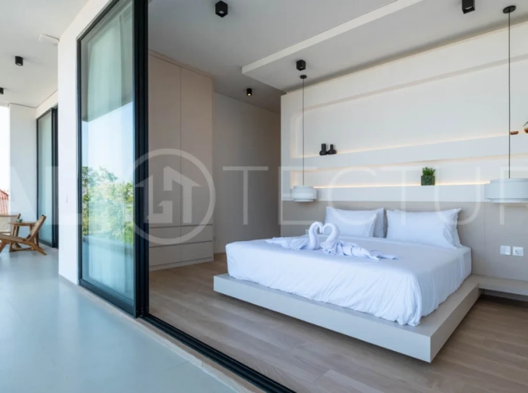 Luxury 3 Bedroom Ocean View Villa for Sale in Ungasan featuring contemporary interiors, a spacious open plan living and dining area, fully equipped designer kitchen with island, three ensuite bedrooms with walk in wardrobes and private balconies, a private swimming pool, panoramic sea views, a 126 sqm rooftop with outdoor kitchenette and entertaining area, plus a private sauna and ice bath. Set on 225 sqm of land with a 477 sqm building area, offered with a 28 year leasehold and guaranteed 30 year extension.