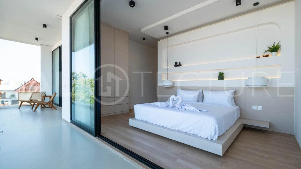 Luxury 3 Bedroom Ocean View Villa for Sale in Ungasan featuring contemporary interiors, a spacious open plan living and dining area, fully equipped designer kitchen with island, three ensuite bedrooms with walk in wardrobes and private balconies, a private swimming pool, panoramic sea views, a 126 sqm rooftop with outdoor kitchenette and entertaining area, plus a private sauna and ice bath. Set on 225 sqm of land with a 477 sqm building area, offered with a 28 year leasehold and guaranteed 30 year extension.