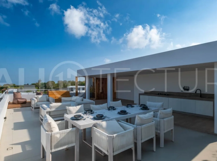 Luxury 3 Bedroom Ocean View Villa for Sale in Ungasan featuring contemporary interiors, a spacious open plan living and dining area, fully equipped designer kitchen with island, three ensuite bedrooms with walk in wardrobes and private balconies, a private swimming pool, panoramic sea views, a 126 sqm rooftop with outdoor kitchenette and entertaining area, plus a private sauna and ice bath. Set on 225 sqm of land with a 477 sqm building area, offered with a 28 year leasehold and guaranteed 30 year extension.