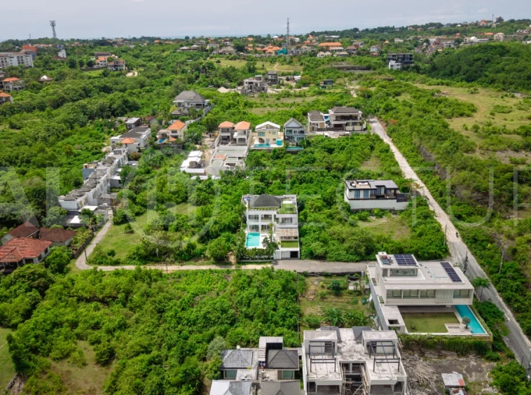 Luxury 4-bedroom turnkey villa for sale in Ungasan, Bali, featuring a private pool, elegant tropical interiors, home cinema, and a 360° panoramic rooftop with ocean, GWK, and Mount Agung views.