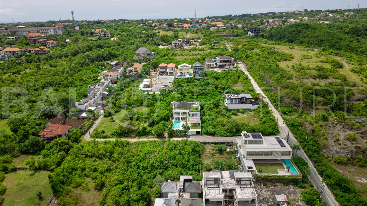 Luxury 4-bedroom turnkey villa for sale in Ungasan, Bali, featuring a private pool, elegant tropical interiors, home cinema, and a 360° panoramic rooftop with ocean, GWK, and Mount Agung views.