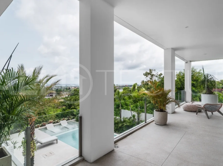 Luxury 4-bedroom turnkey villa for sale in Ungasan, Bali, featuring a private pool, elegant tropical interiors, home cinema, and a 360° panoramic rooftop with ocean, GWK, and Mount Agung views.