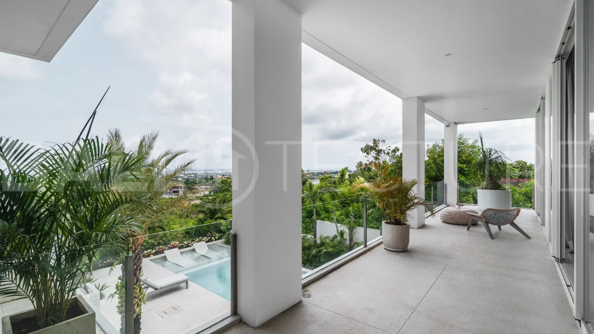 Luxury 4-bedroom turnkey villa for sale in Ungasan, Bali, featuring a private pool, elegant tropical interiors, home cinema, and a 360° panoramic rooftop with ocean, GWK, and Mount Agung views.