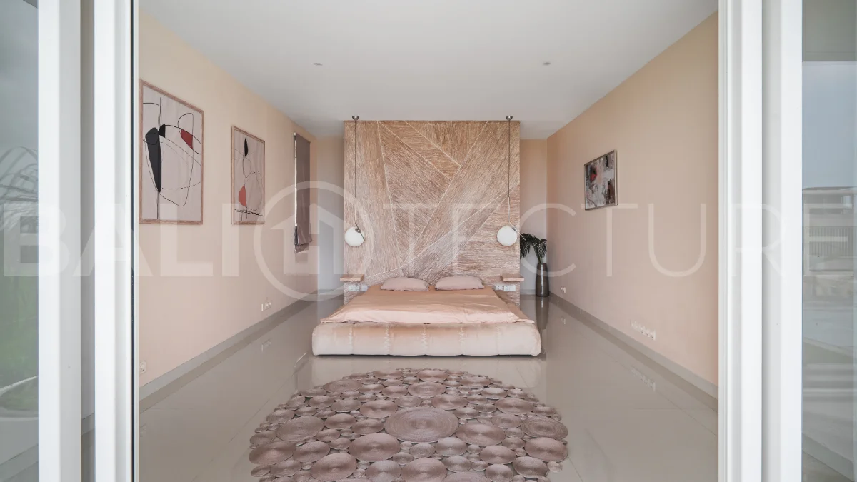 Luxury 4-bedroom turnkey villa for sale in Ungasan, Bali, featuring a private pool, elegant tropical interiors, home cinema, and a 360° panoramic rooftop with ocean, GWK, and Mount Agung views.