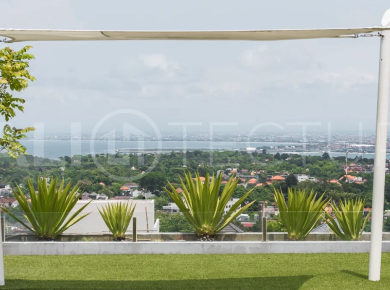 Luxury 4-bedroom turnkey villa for sale in Ungasan, Bali, featuring a private pool, elegant tropical interiors, home cinema, and a 360° panoramic rooftop with ocean, GWK, and Mount Agung views.