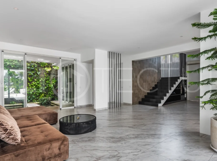 Luxury 4-bedroom turnkey villa for sale in Ungasan, Bali, featuring a private pool, elegant tropical interiors, home cinema, and a 360° panoramic rooftop with ocean, GWK, and Mount Agung views.