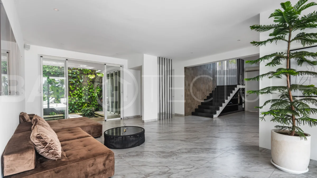 Luxury 4-bedroom turnkey villa for sale in Ungasan, Bali, featuring a private pool, elegant tropical interiors, home cinema, and a 360° panoramic rooftop with ocean, GWK, and Mount Agung views.