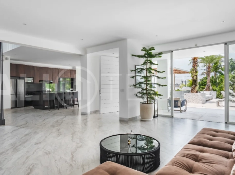 Luxury 4-bedroom turnkey villa for sale in Ungasan, Bali, featuring a private pool, elegant tropical interiors, home cinema, and a 360° panoramic rooftop with ocean, GWK, and Mount Agung views.
