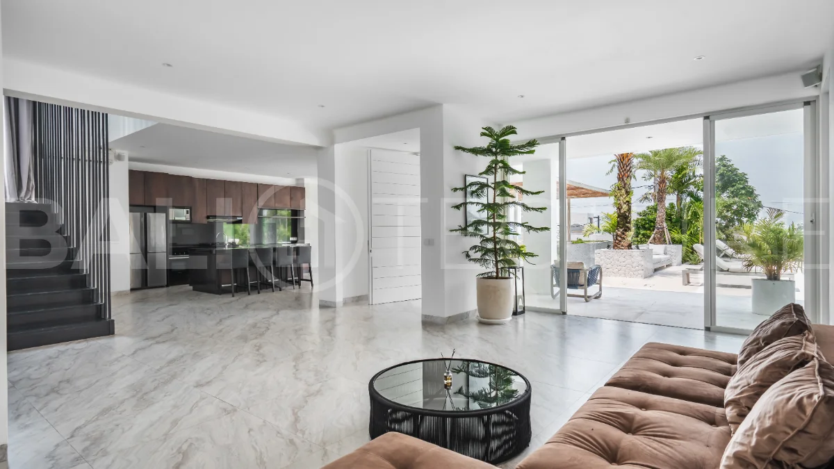 Luxury 4-bedroom turnkey villa for sale in Ungasan, Bali, featuring a private pool, elegant tropical interiors, home cinema, and a 360° panoramic rooftop with ocean, GWK, and Mount Agung views.