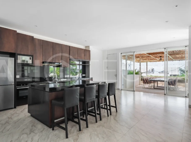 Luxury 4-bedroom turnkey villa for sale in Ungasan, Bali, featuring a private pool, elegant tropical interiors, home cinema, and a 360° panoramic rooftop with ocean, GWK, and Mount Agung views.