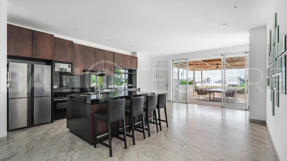 Luxury 4-bedroom turnkey villa for sale in Ungasan, Bali, featuring a private pool, elegant tropical interiors, home cinema, and a 360° panoramic rooftop with ocean, GWK, and Mount Agung views.