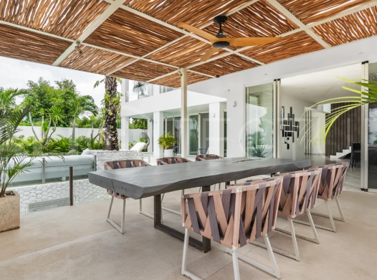 Luxury 4-bedroom turnkey villa for sale in Ungasan, Bali, featuring a private pool, elegant tropical interiors, home cinema, and a 360° panoramic rooftop with ocean, GWK, and Mount Agung views.