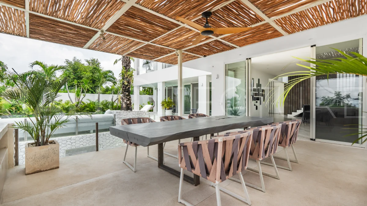 Luxury 4-bedroom turnkey villa for sale in Ungasan, Bali, featuring a private pool, elegant tropical interiors, home cinema, and a 360° panoramic rooftop with ocean, GWK, and Mount Agung views.