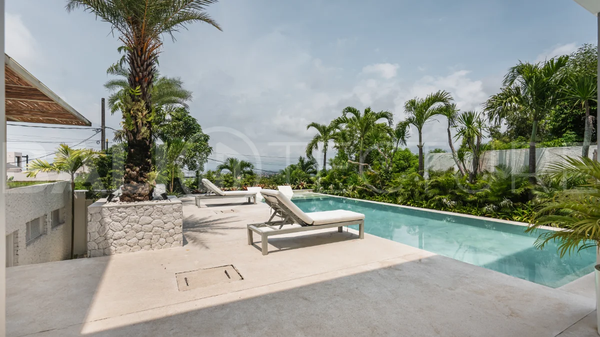 Luxury 4-bedroom turnkey villa for sale in Ungasan, Bali, featuring a private pool, elegant tropical interiors, home cinema, and a 360° panoramic rooftop with ocean, GWK, and Mount Agung views.