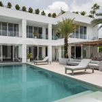 Luxury 4-bedroom turnkey villa for sale in Ungasan, Bali, featuring a private pool, elegant tropical interiors, home cinema, and a 360° panoramic rooftop with ocean, GWK, and Mount Agung views.