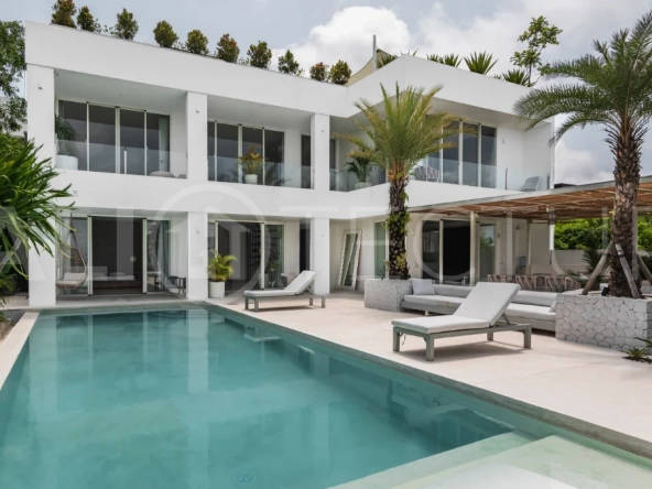 Luxury 4-bedroom turnkey villa for sale in Ungasan, Bali, featuring a private pool, elegant tropical interiors, home cinema, and a 360° panoramic rooftop with ocean, GWK, and Mount Agung views.
