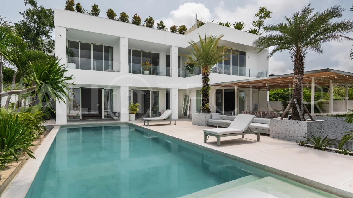 Luxury 4-bedroom turnkey villa for sale in Ungasan, Bali, featuring a private pool, elegant tropical interiors, home cinema, and a 360° panoramic rooftop with ocean, GWK, and Mount Agung views.