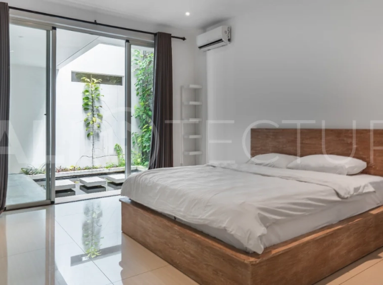 Luxury 4-bedroom turnkey villa for sale in Ungasan, Bali, featuring a private pool, elegant tropical interiors, home cinema, and a 360° panoramic rooftop with ocean, GWK, and Mount Agung views.