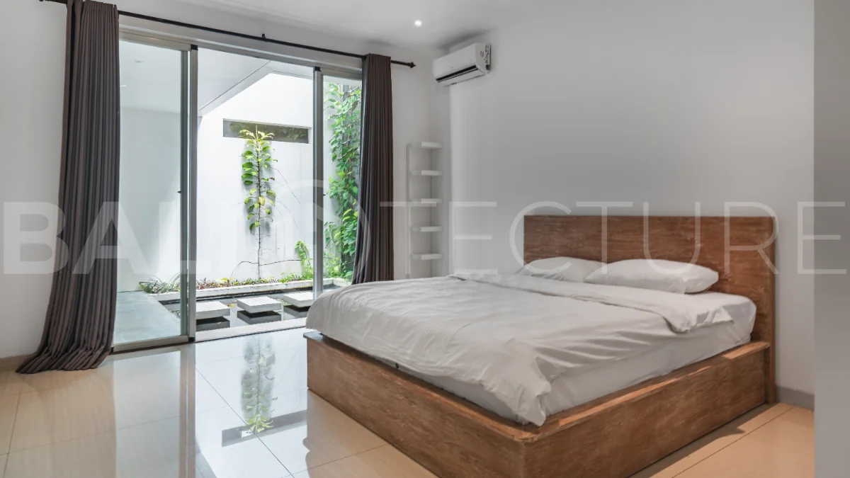 Luxury 4-bedroom turnkey villa for sale in Ungasan, Bali, featuring a private pool, elegant tropical interiors, home cinema, and a 360° panoramic rooftop with ocean, GWK, and Mount Agung views.