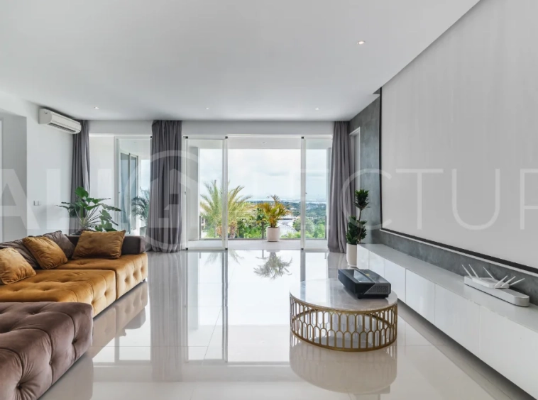 Luxury 4-bedroom turnkey villa for sale in Ungasan, Bali, featuring a private pool, elegant tropical interiors, home cinema, and a 360° panoramic rooftop with ocean, GWK, and Mount Agung views.