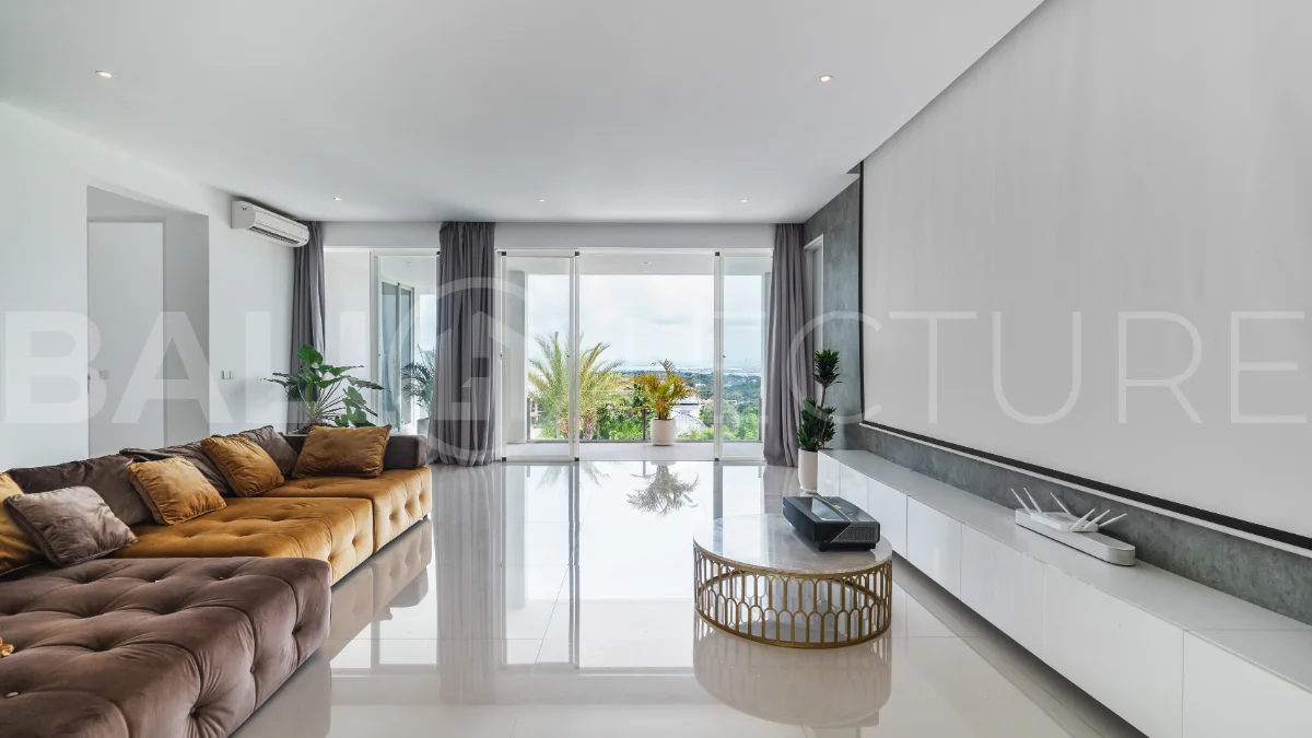 Luxury 4-bedroom turnkey villa for sale in Ungasan, Bali, featuring a private pool, elegant tropical interiors, home cinema, and a 360° panoramic rooftop with ocean, GWK, and Mount Agung views.