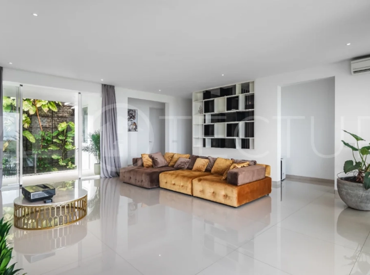 Luxury 4-bedroom turnkey villa for sale in Ungasan, Bali, featuring a private pool, elegant tropical interiors, home cinema, and a 360° panoramic rooftop with ocean, GWK, and Mount Agung views.