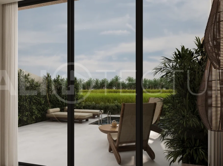 Ricefield View villa for sale in Ubud Centre featuring a tranquil modern interior, enclosed living and kitchen, warm natural tones, and access to premium wellness resort amenities.