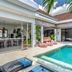 3-bedroom ricefield view villa for sale in Seminyak, featuring a private swimming pool, tropical garden, spacious living areas, and a peaceful residential setting.