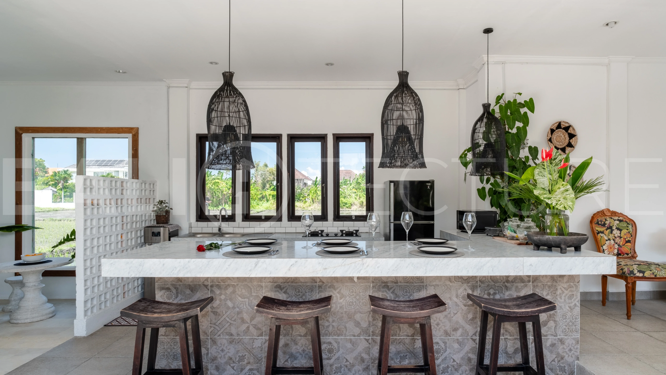 3-bedroom ricefield view villa for sale in Seminyak, featuring a private swimming pool, tropical garden, spacious living areas, and a peaceful residential setting.