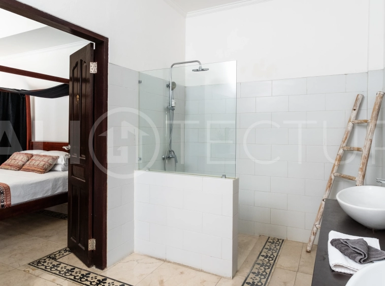 3-bedroom ricefield view villa for sale in Seminyak, featuring a private swimming pool, tropical garden, spacious living areas, and a peaceful residential setting.