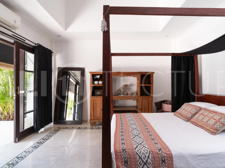 3-bedroom ricefield view villa for sale in Seminyak, featuring a private swimming pool, tropical garden, spacious living areas, and a peaceful residential setting.