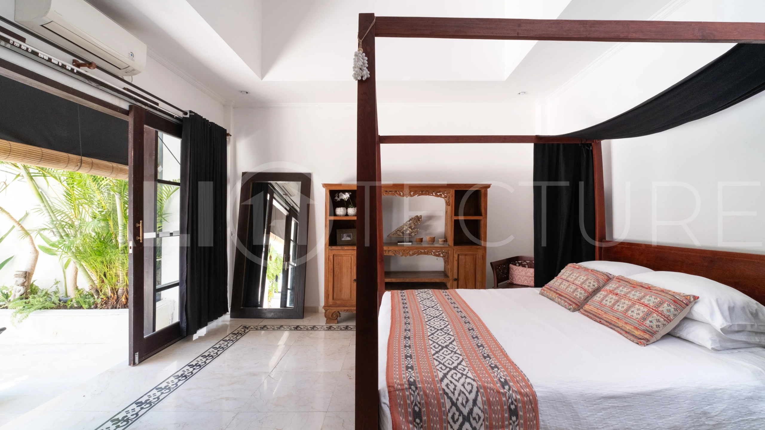 3-bedroom ricefield view villa for sale in Seminyak, featuring a private swimming pool, tropical garden, spacious living areas, and a peaceful residential setting.